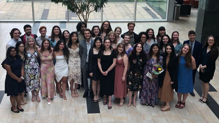 Image of graduating Arts & Science students posing outside of the reception following Convocation 2023
