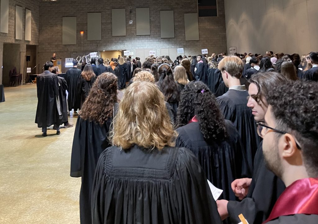 Arts & Science students wait in line backstage prior to receiving their degrees at Spring 2023 convocation