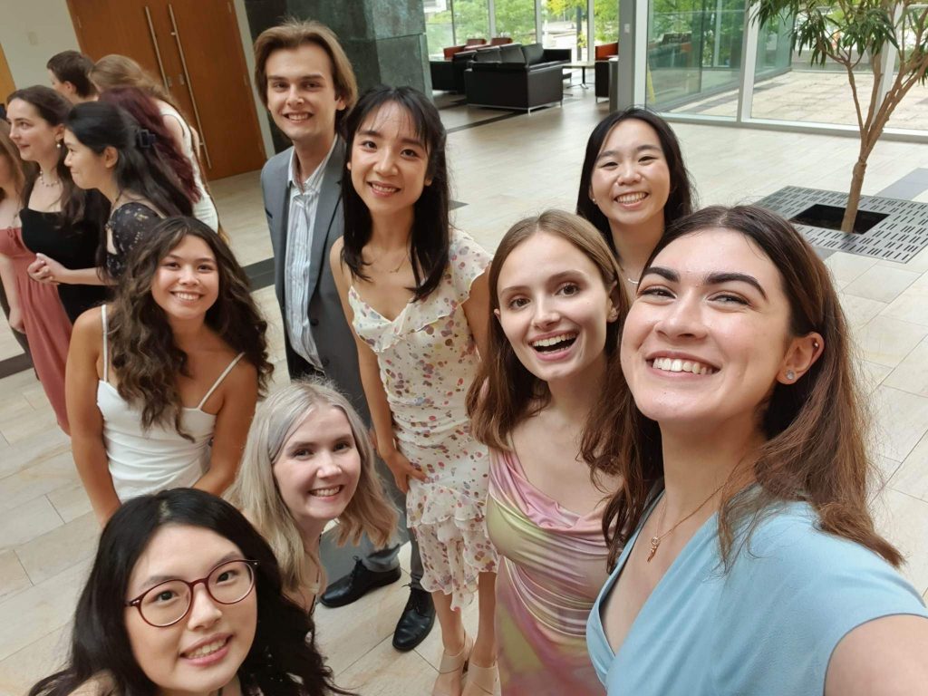 Dalton Bath, Audrey Wu, Elise Wan, Jessie Chan, Gillian Irwin, Phoebe Newton, Maya Verma, and Grace Kim take a group selfie at the 2023 Convocation Reception