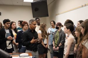 A group of students speaking with the author