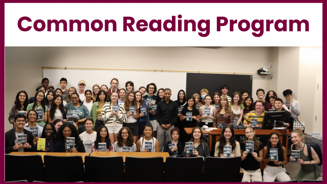 Large group of students holding the "Brother" book standing with the author